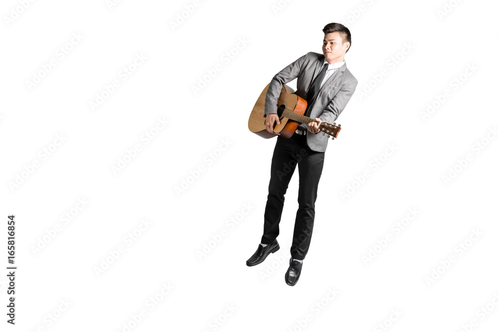 Portrait of a young business man jumping with guitar. Isolated on white background with copy space and clipping path Portrait of a young business man jumping with guitar. Isolated on white background with copy space and clipping path