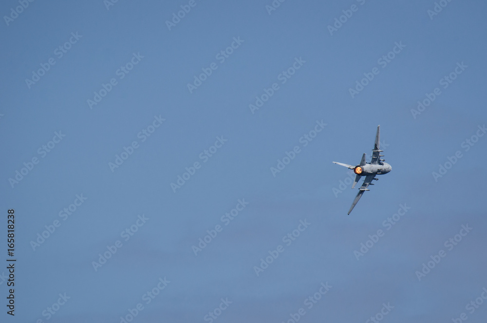 ATTACK AIRCRAFT - A combat aircraft in the blue sky
