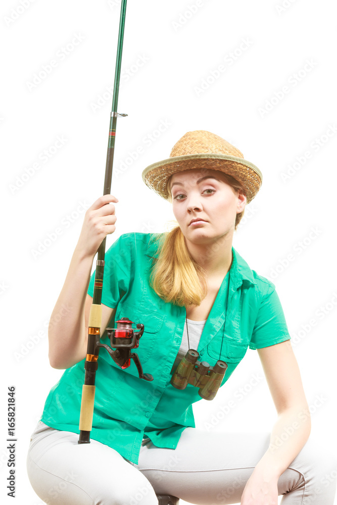 Bored woman with fishing rod, spinning equipment Bored woman with fishing rod, spinning equipment