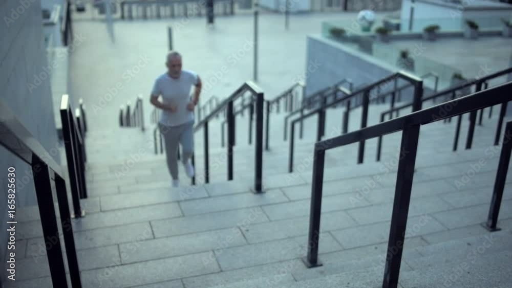 custom made wallpaper toronto digitalSenior sporty man resting after running on the staircases
