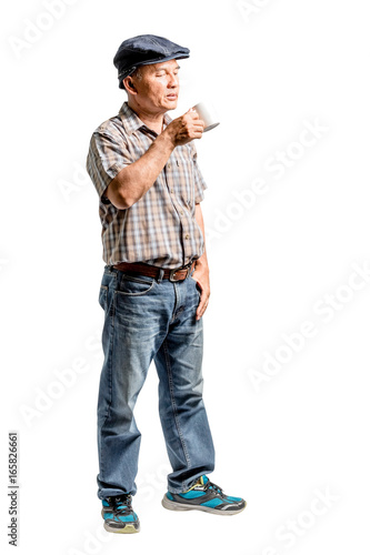 portrait of a mature man drinking a cup of coffee. Isolated full length on white background with clipping path