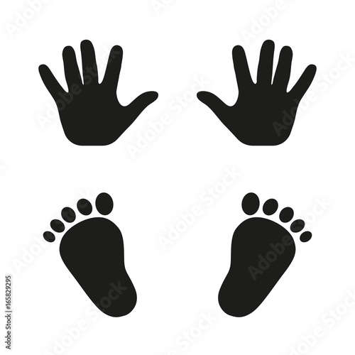 Prints of hands and feet of a child on a white background