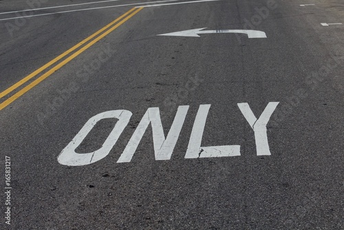 The arrow and the word only painted white on the road.