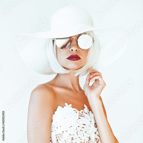 Beautiful lady in hat and sunglasses photo
