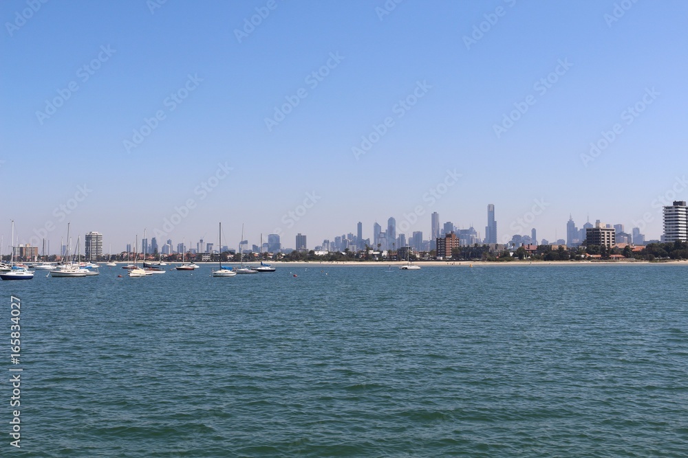 Cityskyline viewed from the sea with boats and space for text