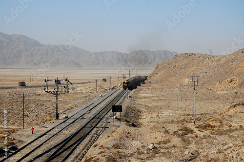 A Train moving ahead in the desolate, hilly area of Bolan Pass in Balochistan, Pakistan