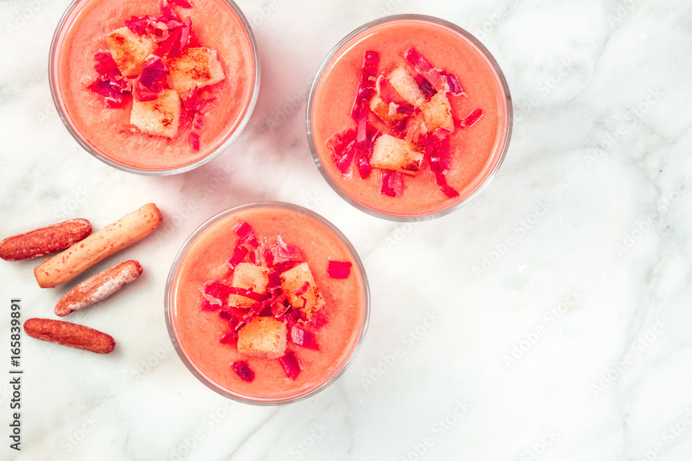 Salmorejo in glasses with breadsticks, and copy space Salmorejo in glasses with breadsticks, and copy space