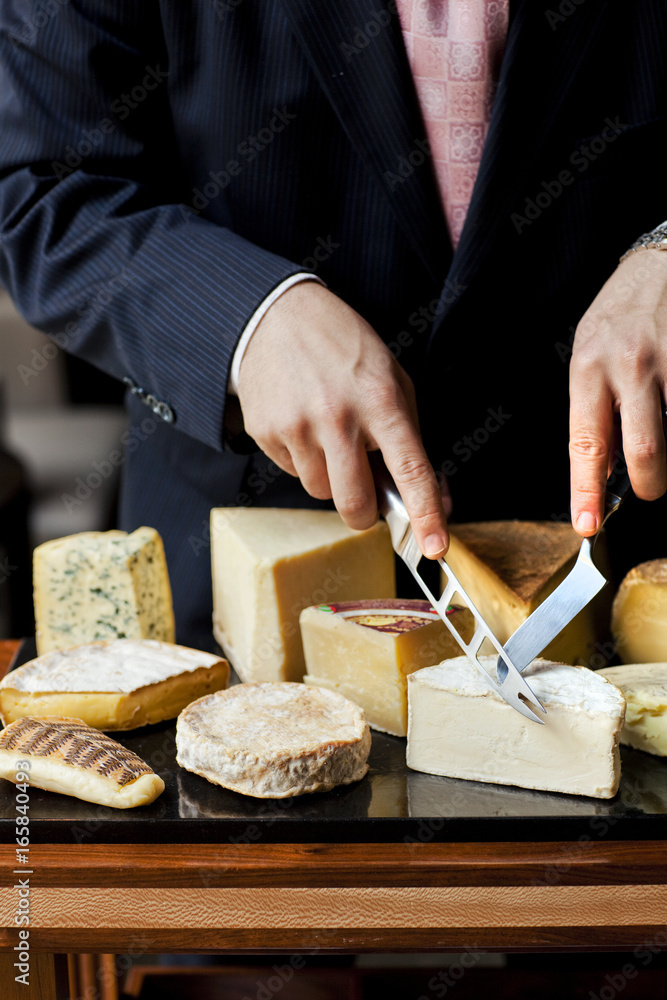 © Sara Remington Photography LLC/Stocksy - Serving Cheese In A Five Star Restaurant © Sara Remington Photography LLC/Stocksy - Serving Cheese In A Five Star Restaurant