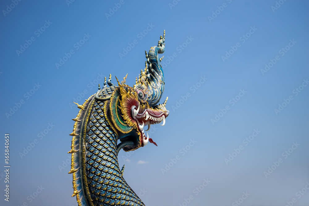 Fototapeta premium The naga statue on blue sky background in thailand.