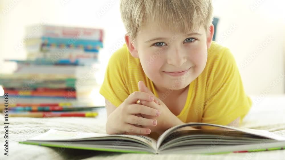Portrait of a funny boy with a book. Portrait of a funny boy with a book.