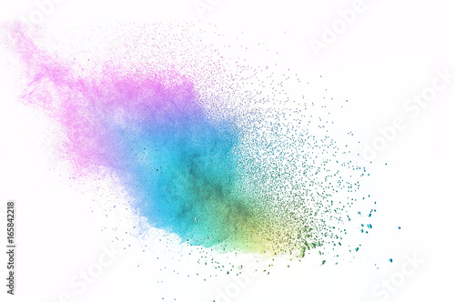 Abstract art powder paint on white background. Movement abstract frozen dust explosion multicolored on white background. Stop the movement of colored powder on white background.