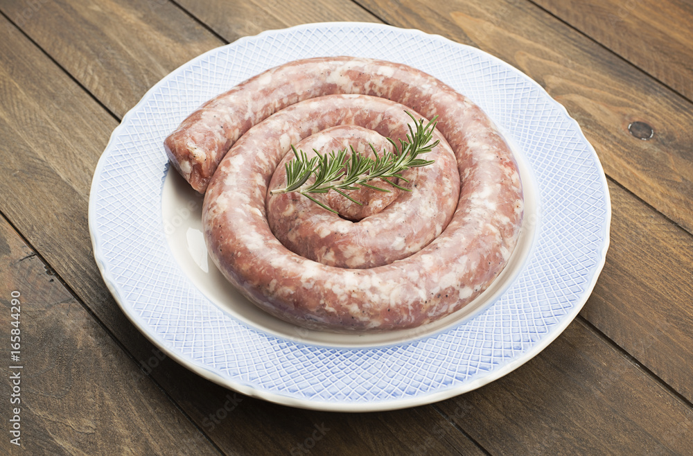 Fototapeta premium Uncooked sausage on table