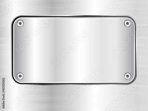 Metal plate background, steel nameplate with screws.