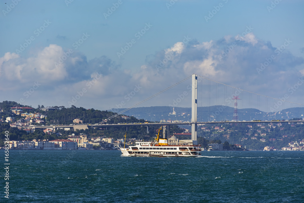 shot of Istanbul Bosphorus Bridge,and the old passenger steamboat