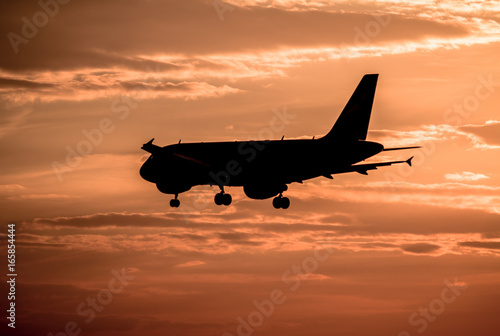Wallpaper Mural Airplane landing at sunset Torontodigital.ca