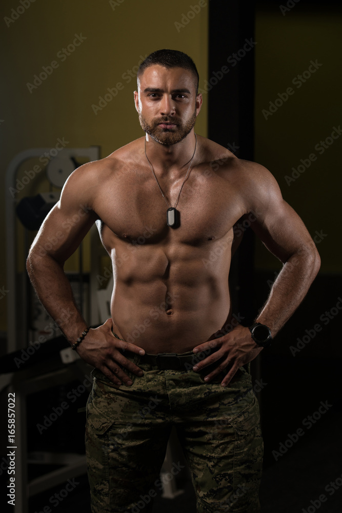 Portrait Of A Muscular Man In Army Pants