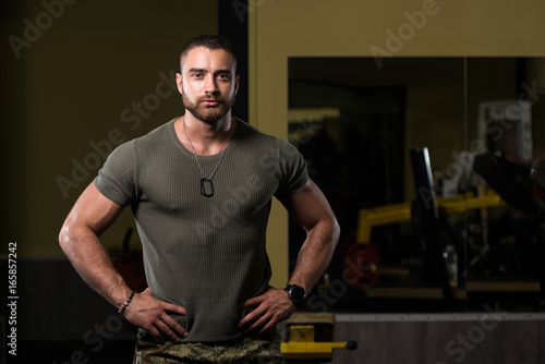 Portrait Of A Muscular Man In Green T-shirt