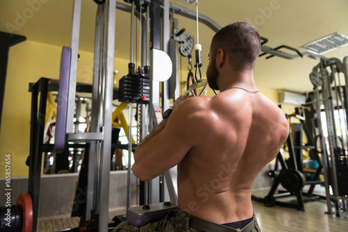 Athlete Doing Heavy Weight Exercise For Back
