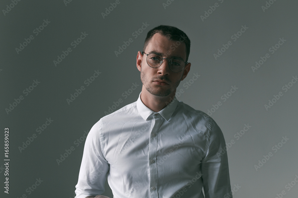 A lonely handsome guy in a raincoat and glasses with different moods A lonely handsome guy in a raincoat and glasses with different moods