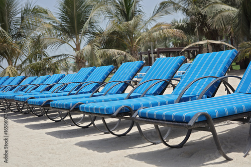 Beach Chairs on by the sea. Summer holiday vacation and travel background. photo