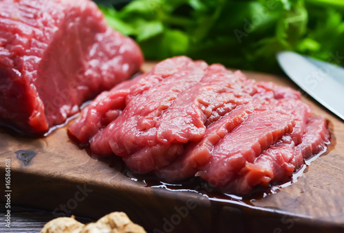 Raw beef meat on a cutting board