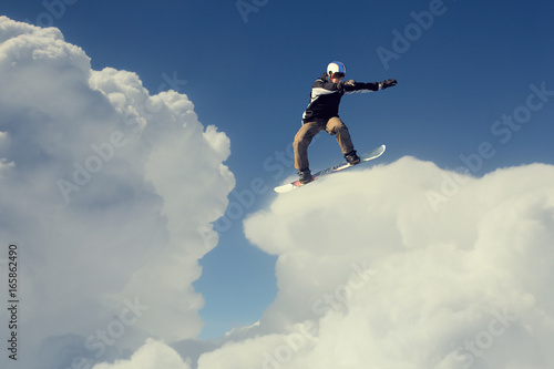 Snowboarder making jump © Sergey Nivens