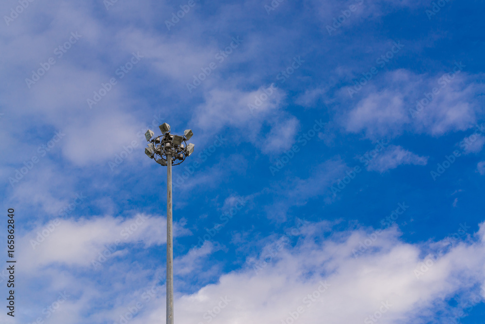 Lamp post electricity industry with blue sky. Spotlight tower.