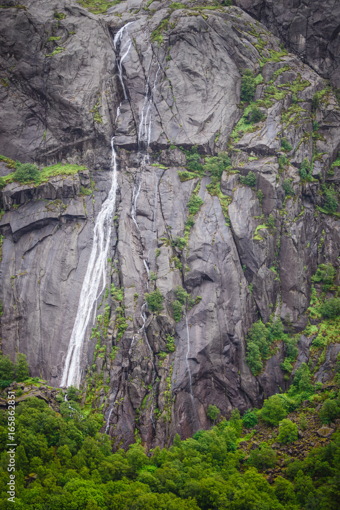 Rocks and stones cliffs with waterfall Rocks and stones cliffs with waterfall