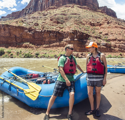 Couple on a rafting trip together down the scenic Colorado River near Moab, Utah