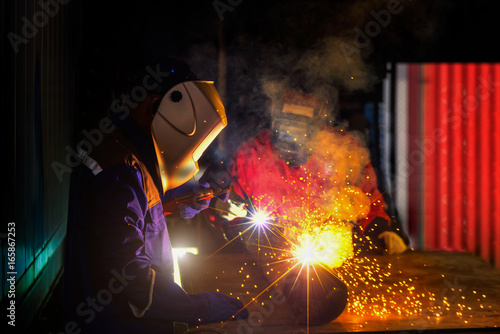 Industrial Worker at the factory welding closeup