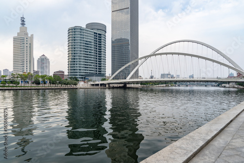 Tianjin city waterfront downtown skyline with Haihe river China.