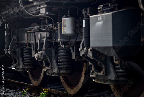 A closeup view of the wheels of a train