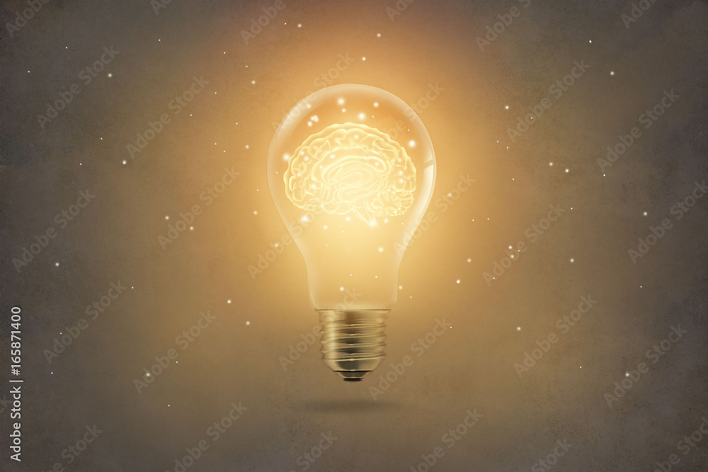 golden brain glowing inside light bulb on paper texture background Stock  Photo | Adobe Stock