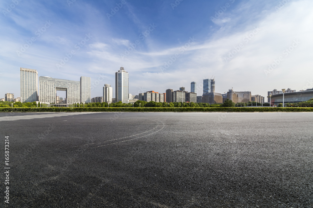 Panoramic skyline and buildings with empty road Panoramic skyline and buildings with empty road