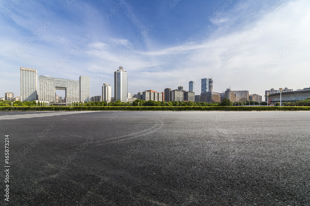 Panoramic skyline and buildings with empty road