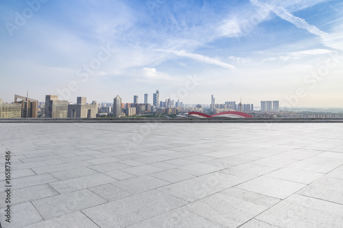 Panoramic skyline and buildings with empty concrete square floor