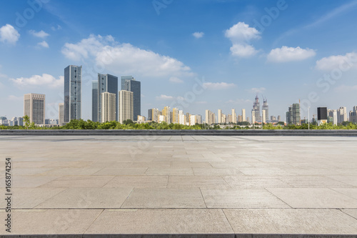 Panoramic skyline and buildings with empty road