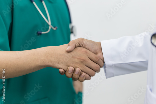 Doctors team shaking hands together
