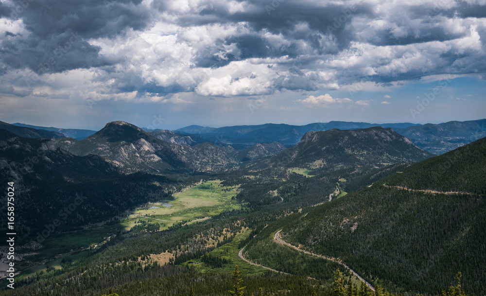Snowy clouds over a mountain valley in the Rocky Mountains. Rocky Mountain National Park