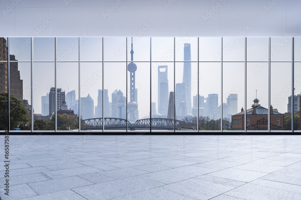 Fototapeta premium Panoramic skyline and buildings from glass window