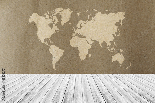 Cardboard paper texture, with white wood terrace and world map © pongmoji
