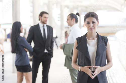 Young Beautiful business woman in city looking out and thinking about work. Young business woman with leader concept. White female thinking about business concept.