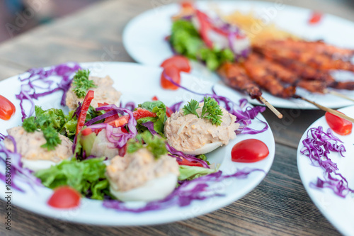 Eggs filled with tuna spread and vegetable salad