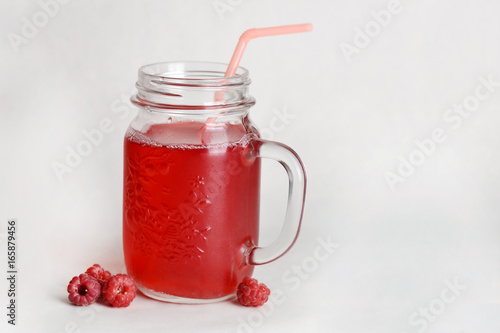 Raspberry drink in a glass jar.