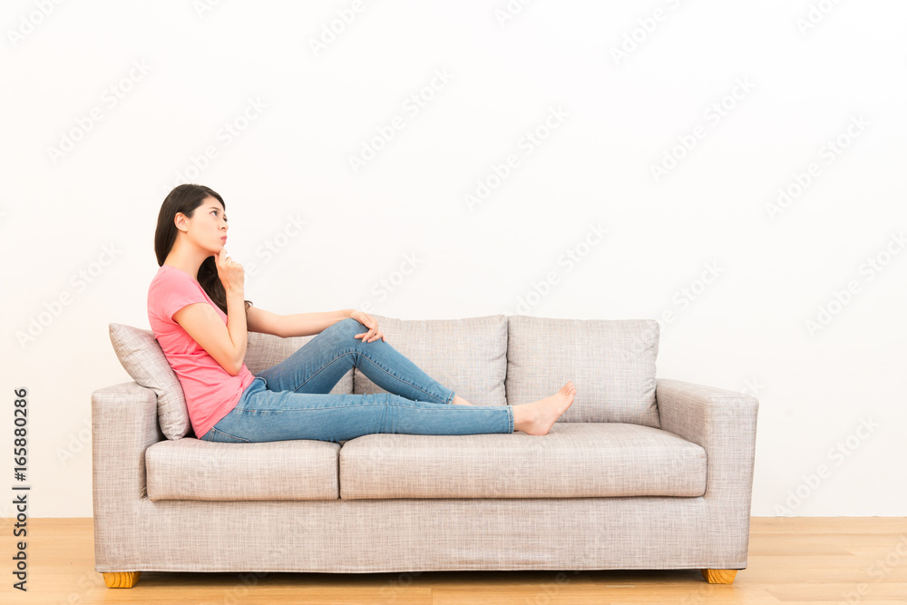 female student sitting on the living room sofa female student sitting on the living room sofa