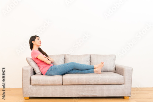 beautiful woman resting on the couch sofa