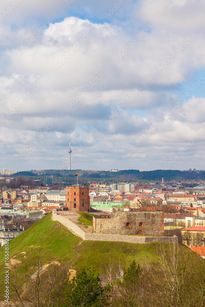View of historical Gediminas hill with Gediminas Tower on it and the city of Vilnius from Three Crosses hill. Vilnius, a capital of Lithuania,  on a sunny spring day.