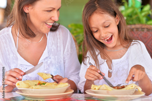 mother and daughter eating in cafe © aletia2011