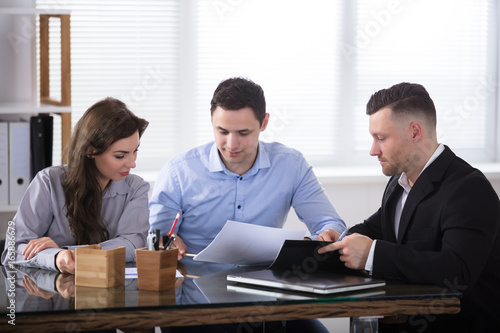 Advisor Discussing With Couple