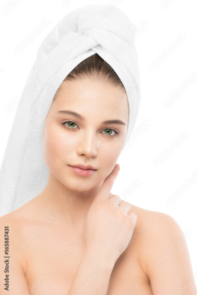 Beautiful young brunette woman with clean face and towel on her head. Beauty spa model girl perfect fresh clean skin. Youth and skin care concept. Isolated. Beautiful young brunette woman with clean face and towel on her head. Beauty spa model girl perfect fresh clean skin. Youth and skin care concept. Isolated.